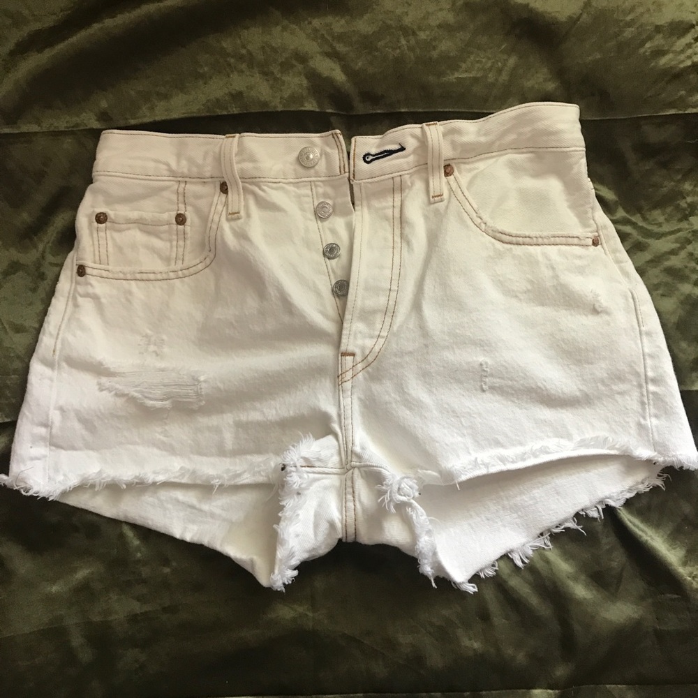 white button-up Levi shorts with front rips